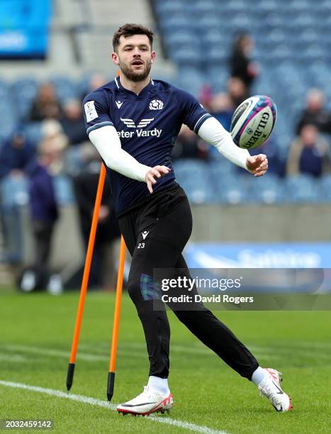 Blair Kinghorn passes the ball during the Scotland Captain's Run ahead of the Guinness Six Nations 2024 match against England at BT Murrayfield...