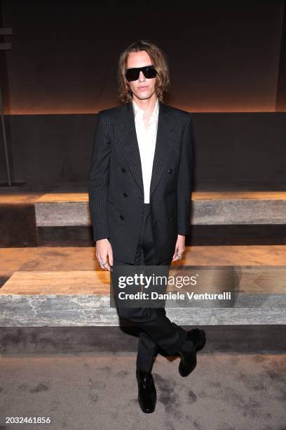 Jamie Campbell Bower is seen on the front row at the Tom Ford fashion show during the Milan Fashion Week Womenswear Fall/Winter 2024-2025 on February...