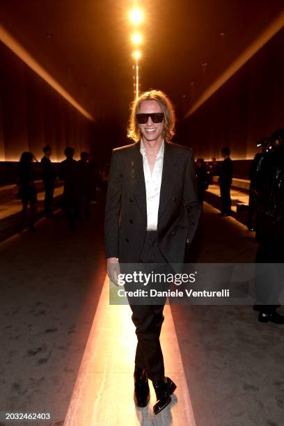 Jamie Campbell Bower is seen on the front row at the Tom Ford fashion show during the Milan Fashion Week Womenswear Fall/Winter 2024-2025 on February...