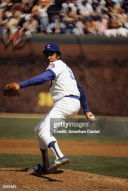 Fergie Jenkins of the Chicago Cubs winds back to pitch in a game during the 1983 season at Wrigley Field in Chicago, Illinois.