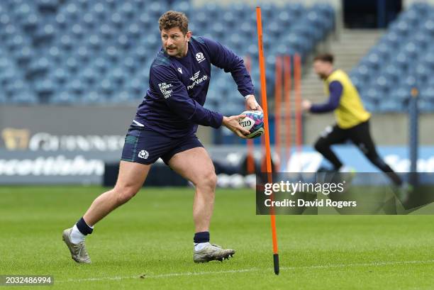 Alec Hepburn runs with the ball during the Scotland Captain's Run ahead of the Guinness Six Nations 2024 match against England at BT Murrayfield...