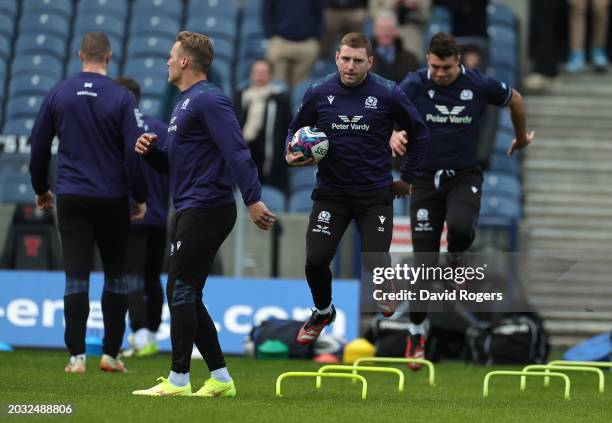 Finn Russell runs with the ball during the Scotland Captain's Run ahead of the Guinness Six Nations 2024 match against England at BT Murrayfield...