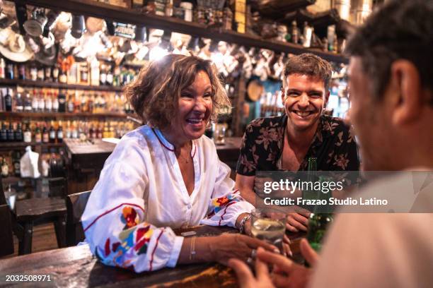 friends having fun at the pub - 60s cocktail party stock pictures, royalty-free photos & images