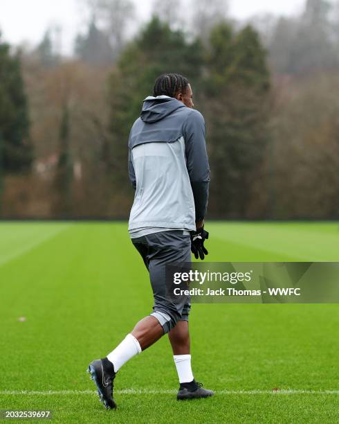 Jean-Ricner Bellegarde of Wolverhampton Wanderers makes their way out to the pitch ahead of a Wolverhampton Wanderers Training Session at The Sir...