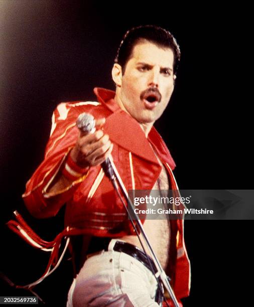 Freddie Mercury performs with Queen at the Milton Keynes National Bowl, Buckinghamshire, June 1982.