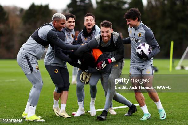 Mario Lemina, Pedro Neto, Pablo Sarabia, Jose Sa and Hugo Bueno of Wolverhampton Wanderers try to get Nelson Semedo to pose for a photo with them...