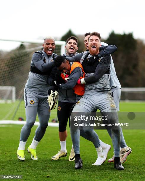 Mario Lemina, Pedro Neto, Pablo Sarabia and Jose Sa of Wolverhampton Wanderers try to get Nelson Semedo to pose for a photo with them during a...