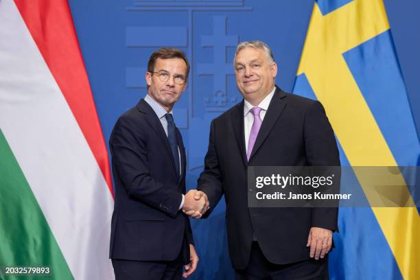 Hungary's Prime Minister Viktor Orban and Swedish Prime Minister Ulf Kristersson shake hands after a press conference following their meeting in...