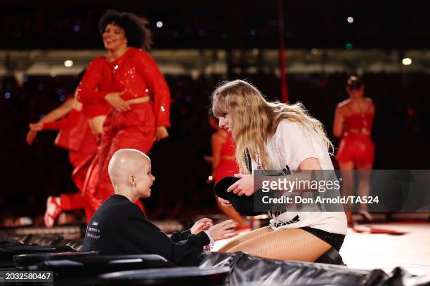 Young fan receives a hat from Taylor Swift during her performance at Accor Stadium on February 23, 2024 in Sydney, Australia.