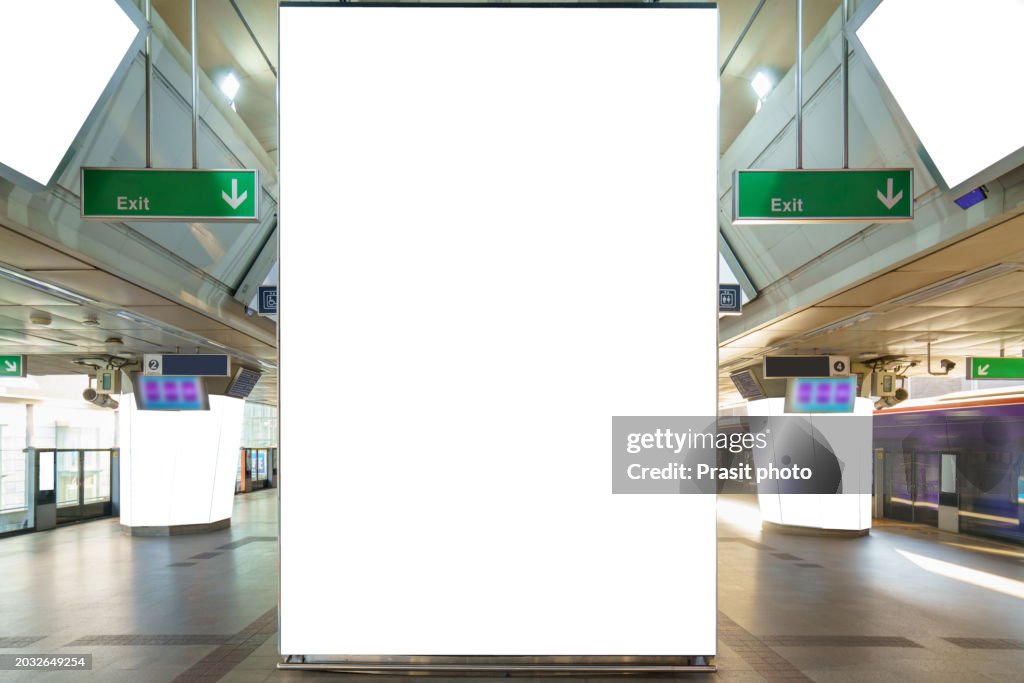 White billboard mock up is located on subway or train station to advertise