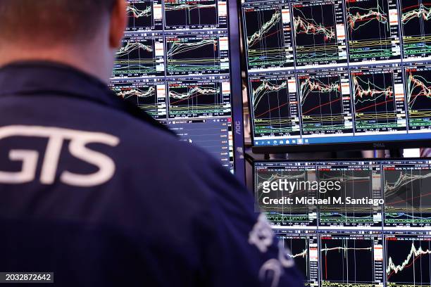 Traders work on the floor of the New York Stock Exchange during morning trading on February 23, 2024 in New York City. The market opened continuing...