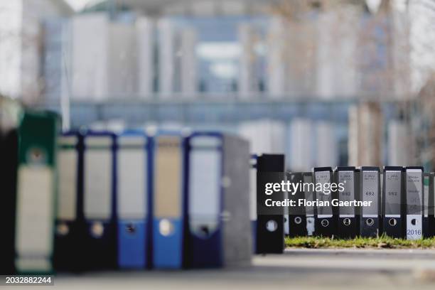 Folders are pictured during a protest of the Central Association of German Crafts in front of the Federal Chancellery on February 26, 2024 in Berlin,...