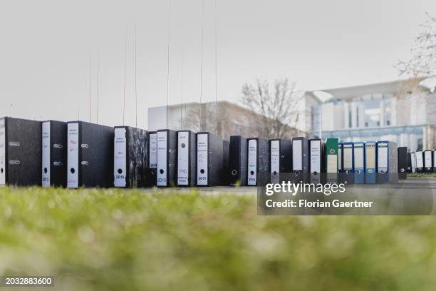 Folders are pictured during a protest of the Central Association of German Crafts in front of the Federal Chancellery on February 26, 2024 in Berlin,...