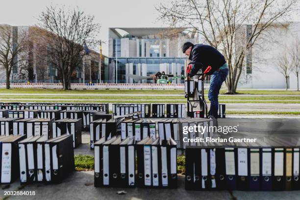 Folders are removed after a protest of the Central Association of German Crafts in front of the Federal Chancellery on February 26, 2024 in Berlin,...