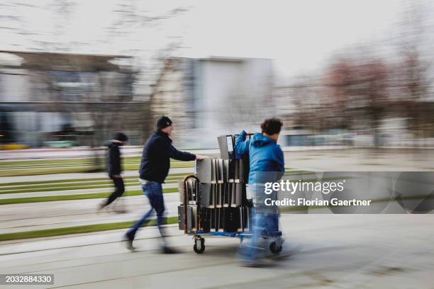 Folders are removed after a protest of the Central Association of German Crafts in front of the Federal Chancellery on February 26, 2024 in Berlin,...