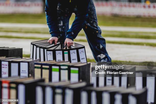 Folders are removed after a protest of the Central Association of German Crafts in front of the Federal Chancellery on February 26, 2024 in Berlin,...