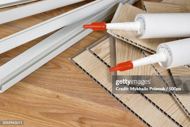 high angle view of work tools on table - linoleum table stock pictures, royalty-free photos & images