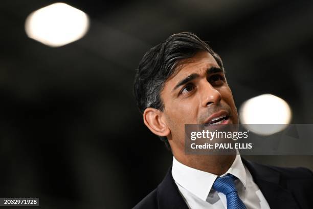 Britain's Prime Minister Rishi Sunak reacts as he speaks during an interview following a visit in the Siemens Mobility factory, in Goole, East...