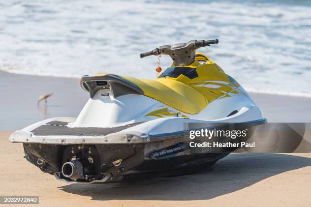 jet ski sitting on the beach in front of ocean water - guerrero stock pictures, royalty-free photos & images