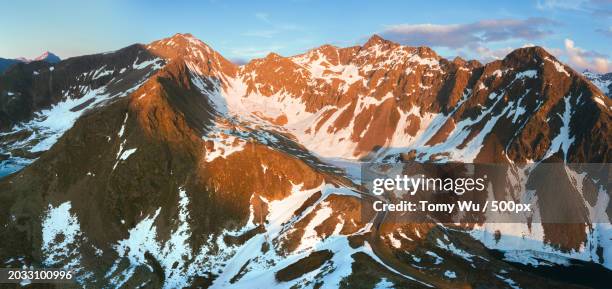 scenic view of snowcapped mountains against sky - tomy stock pictures, royalty-free photos & images