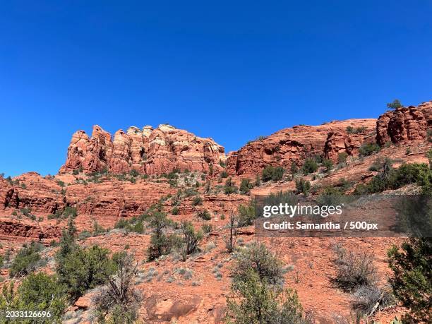 low angle view of rocky mountains against clear blue sky,sedona,arizona,united states,usa - sightseeing in sedona stock pictures, royalty-free photos & images