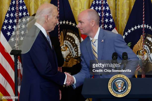 President Joe Biden is introduced by Utah Governor Spencer Cox during an event with governors from across the country in the East Room of the White...