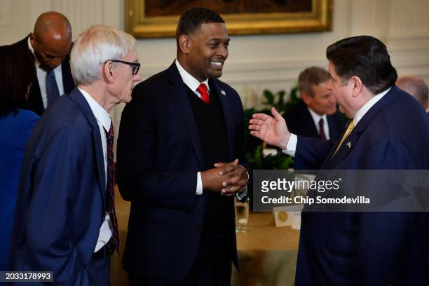 Wisconsin Governor Tony Evers and Illinois Governor J.B. Pritzker talk with Environmental Protection Agency Administrator Michael Regan during event...