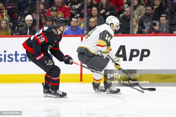 Vegas Golden Knights Defenceman Nicolas Hague skates with the puck against Ottawa Senators Right Wing Drake Batherson during first period National...