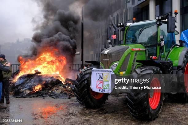 Farmers burn tires as a protest in the heart of the EU district on February 26, 2024 in Brussels, Belgium. Hundreds of Belgian farmers marched...