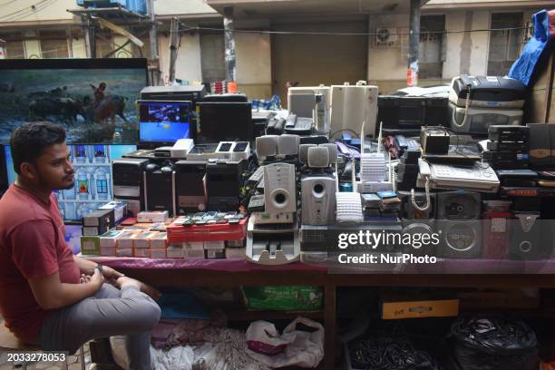 Person is selling second-hand electronic gadgets inside a second-hand electronics market in Kolkata, India, on February 26, 2024.