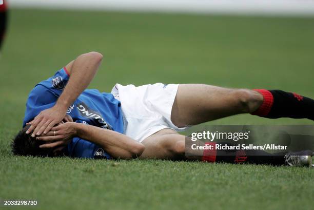 Nacho Novo of Glasgow Rangers is injured during the Scottish Premiership match between Motherwell and Glasgow Rangers at Fir Park on October 17, 2004...