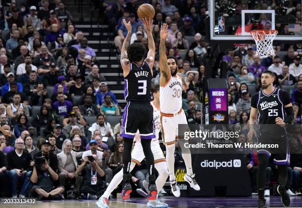 Chris Duarte of the Sacramento Kings shoots over Julian Champagnie of the San Antonio Spurs during the second quarter of an NBA basketball game at...