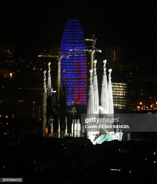 The Agbar Tower, new symbol of Barcelona designed by French architect Jean Nouvel, is lit up 23 March 2006 by projectors displaying the European flag...