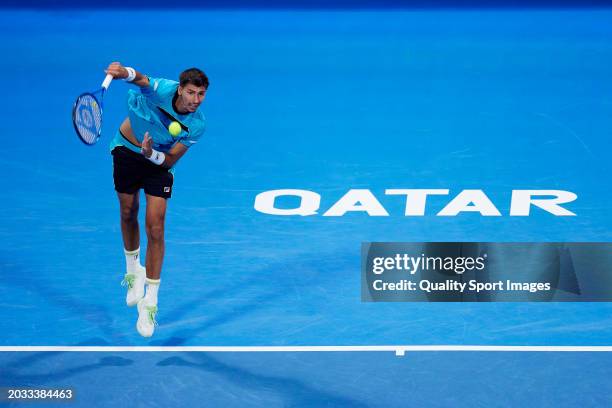 Alexei Popyrin of Australia serves against Karen Khachanov in their Semi Final match during the Qatar ExxonMobil Open at Khalifa International Tennis...