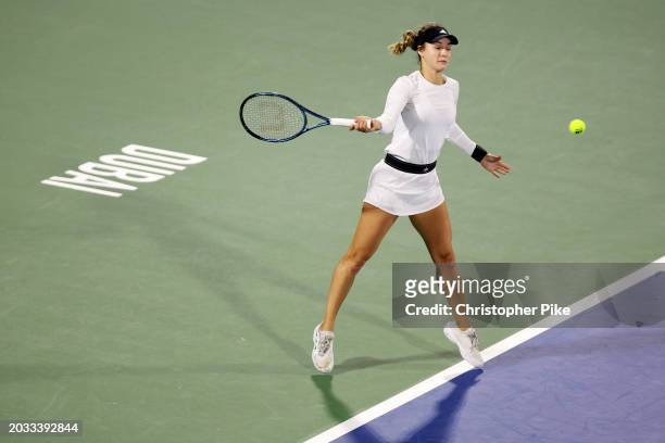 Anna Kalinskaya plays a forehand against Iga Swiatek of Poland in their women's semifinal match during the Dubai Duty Free Tennis Championships, part...