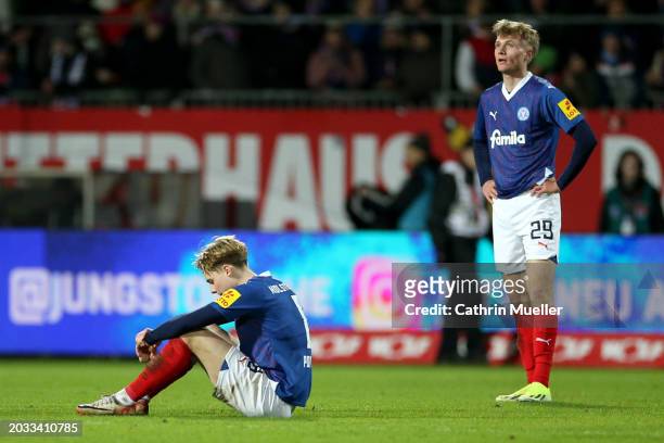 Finn Porath and Niklas Niehoff of Holstein Kiel look dejected after the team's defeat in the Second Bundesliga match between Holstein Kiel and FC St....