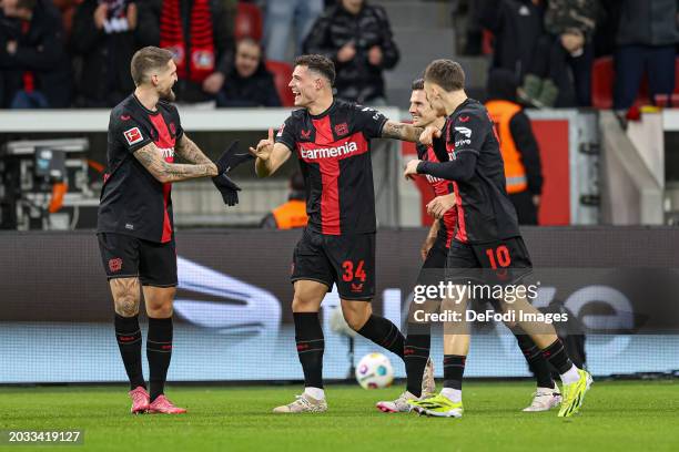 Granit Xhaka of Bayer 04 Leverkusen celebrates after scoring his team's first goal with teammates during the Bundesliga match between Bayer 04...