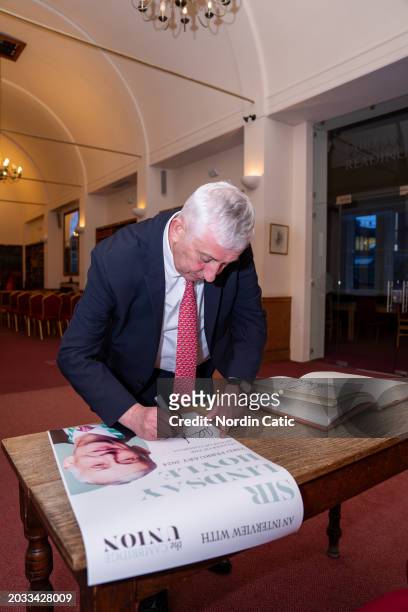 Sir Lindsay Hoyle, Speaker of the House of Commons, signs visitors book at The Cambridge Union on February 23, 2024 in Cambridge, England.