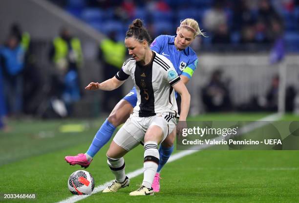 Marina Hegering of Germany is challenged by Eugenie Le Sommer of France during the UEFA Women's Nations League Semi-Final match between France and...