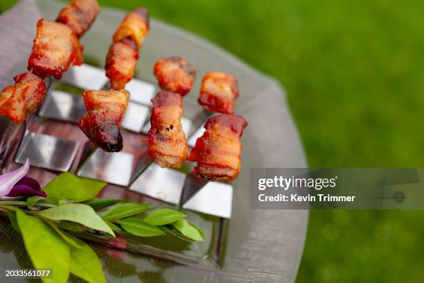 bacon wrapped snacks outdoors - half street stock pictures, royalty-free photos & images