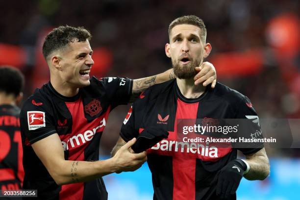 Robert Andrich of Bayer Leverkusen celebrates with Granit Xhaka of Bayer Leverkusen after scoring his team's second goal during the Bundesliga match...