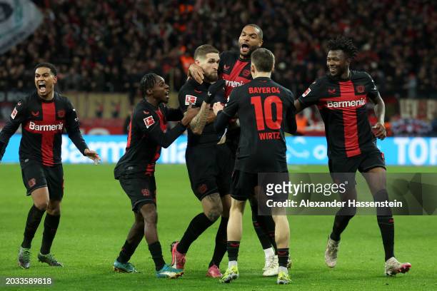 Robert Andrich of Bayer Leverkusen celebrates with teammates after scoring his team's second goal during the Bundesliga match between Bayer 04...