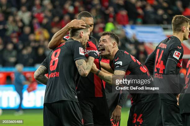 Robert Andrich of Bayer 04 Leverkusen celebrates after scoring his team's second goal with teammates during the Bundesliga match between Bayer 04...