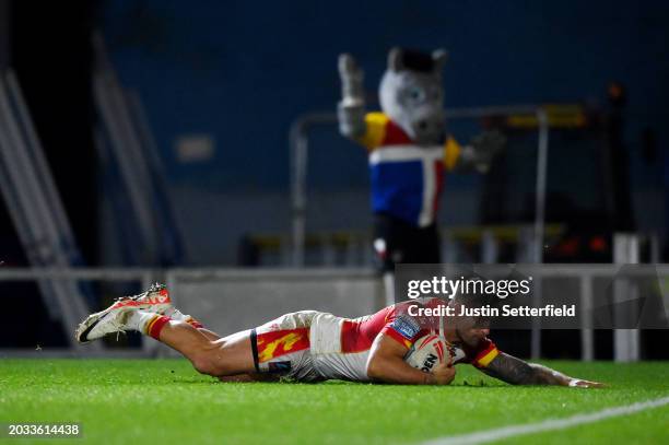 Tariq Sims of Catalans Dragons goes over to score his side's fourth try during the Betfred Super League match between London Broncos and Catalans...