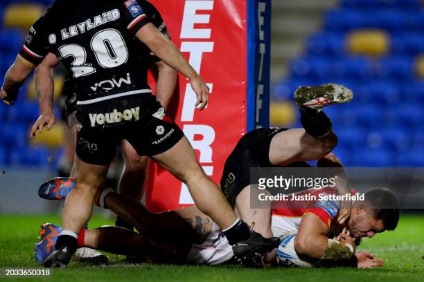 Jayden Nikorama of Catalans Dragons goes over to score his side's fifth try during the Betfred Super League match between London Broncos and Catalans...