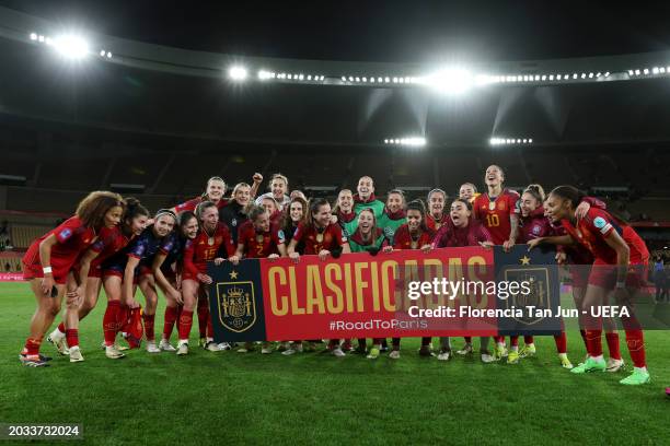 Players of Spain celebrate behind a 'Clasificadas - #RoadToParis' banner after the team's victory in the UEFA Women's Nations League 2024 semifinal...