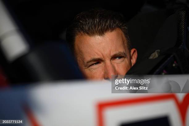 Allmendinger, driver of the Campers Inn RV Chevrolet, looks on in his car during qualifying for the NASCAR Xfinity Series King of Tough 250 at...