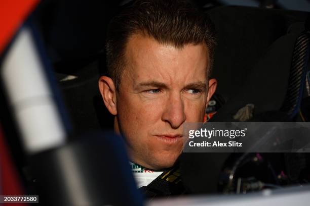 Allmendinger, driver of the Campers Inn RV Chevrolet, looks on in his car during qualifying for the NASCAR Xfinity Series King of Tough 250 at...