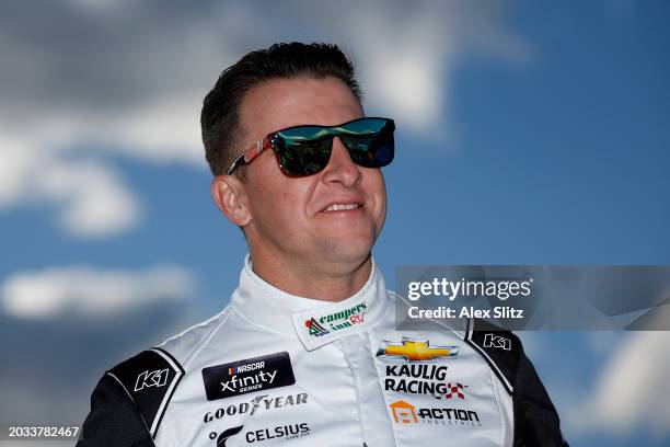 Allmendinger, driver of the Campers Inn RV Chevrolet, looks on during qualifying for the NASCAR Xfinity Series King of Tough 250 at Atlanta Motor...