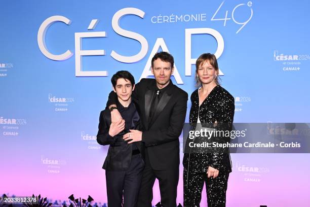 Milo Machado-Graner, Antoine Reinartz and Sandra Hüller arrive at the 49th Cesar Film Awards at L'Olympia on February 23, 2024 in Paris, France.